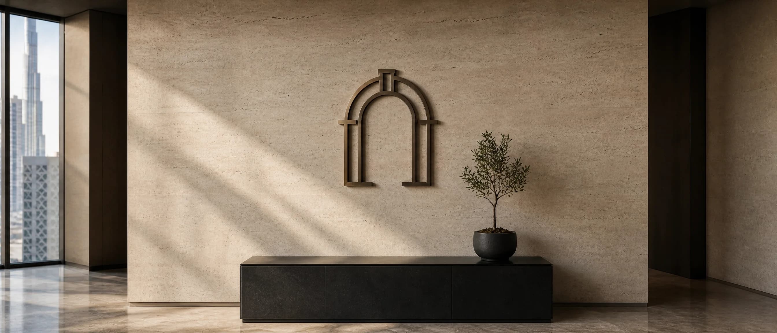 A sunlit reception with an arched doorway and a view of the Burj Khalifa, Maison Monchef's Dubai home.